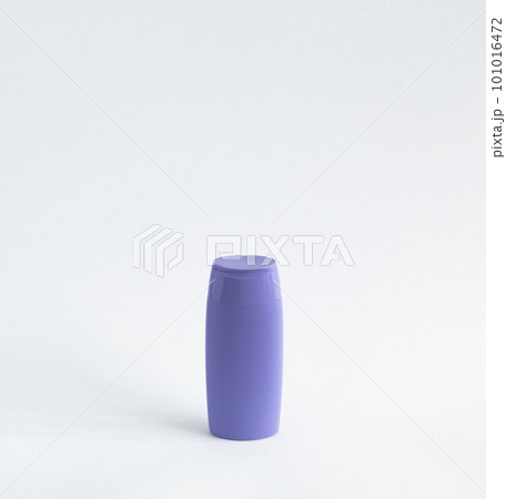 Violet plastic bottle of body care and beauty products. Studio photography of plastic bottle for shampoo, shower gel, creme isolated on white background. Violet plastic bottle of body care and beauty products. Studio photography of plastic bottle for shampoo, shower gel, creme isolated on white background. 101016472
