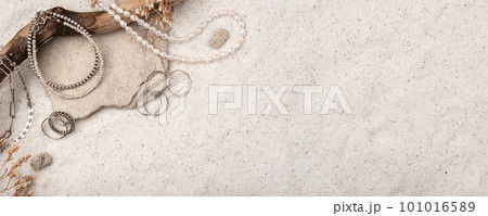 Beautiful Silver and Pearl Jewelry on white sand. Beautiful Silver and Pearl Jewelry on white sand. 101016589
