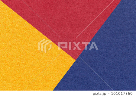 Texture of craft yellow, red and navy blue shade color paper background, macro. Structure of vintage abstract cardboard Texture of craft yellow, red and navy blue shade color paper background, macro. Structure of vintage abstract cardboard 101017360