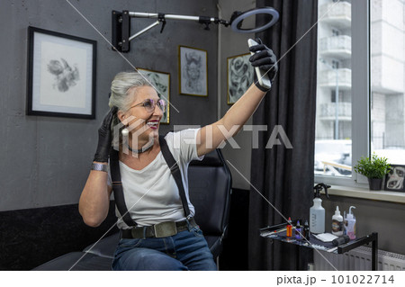 Excited mature woman making selfie and smiling 101022714