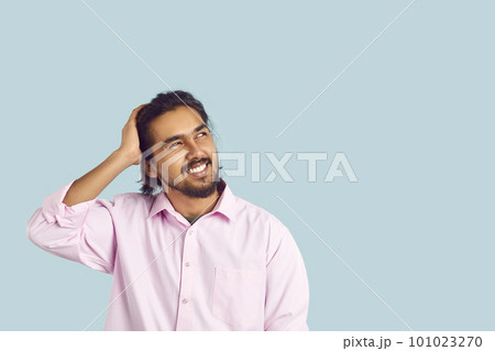 Man with funny facial expression is trying to remember what he forgot by looking at copy space. Man with funny facial expression is trying to remember what he forgot by looking at copy space. 101023270