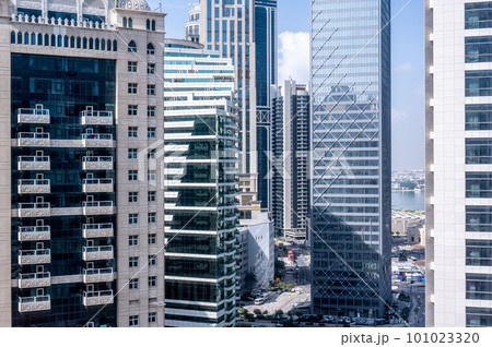 modern building. Skyscrapers with glass facade. Modern buildings in Doha business district. Business, economy and finances concept. 101023320