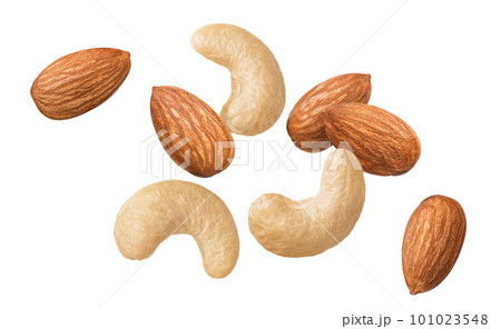 Flying fresh cashew and almond nuts isolated on white background. Top view Flying fresh cashew and almond nuts isolated on white background. Top view 101023548