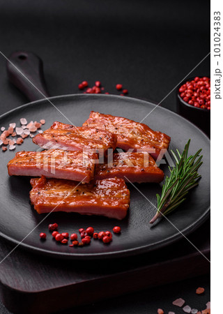 Grilled fresh juicy ribs with salt, spices and herbs 101024383