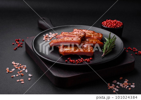 Grilled fresh juicy ribs with salt, spices and herbs 101024384