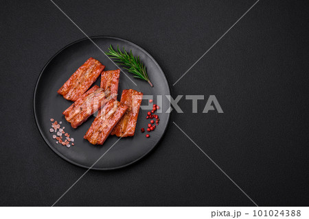 Grilled fresh juicy ribs with salt, spices and herbs 101024388