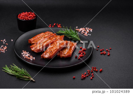 Grilled fresh juicy ribs with salt, spices and herbs 101024389