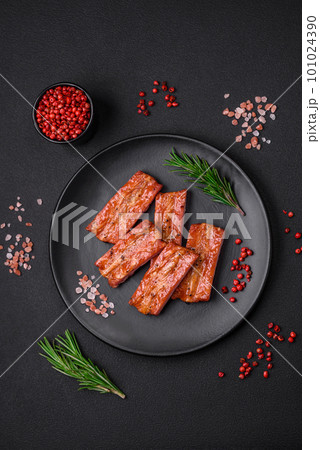 Grilled fresh juicy ribs with salt, spices and herbs 101024390
