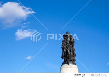 Monument to a Soviet soldier with a sword holding a German child at the Soviet War Memorial in Treptower Park, Berlin, Germany Monument to a Soviet soldier with a sword holding a German child at the Soviet War Memorial in Treptower Park, Berlin, Germany 101024680