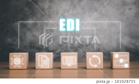 EDI-electronic data interchange concept, Wooden cube block with virtual screen EDI icon on wooden desk. EDI-electronic data interchange concept, Wooden cube block with virtual screen EDI icon on wooden desk. 101028755
