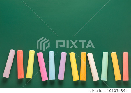 colored chalks on green blackboard, concept colored chalks on green blackboard, concept 101034394