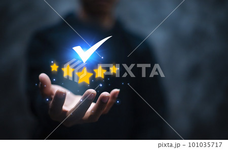 Man's hand shows the sign of the top service Quality assurance, Guarantee, Standards, satisfaction and standardization concept. 101035717