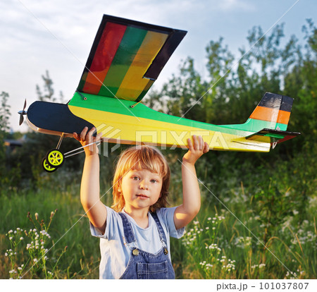 children with airplan toy outdoors children with airplan toy outdoors 101037807