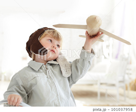 happy boy with airplane in hand 101037958
