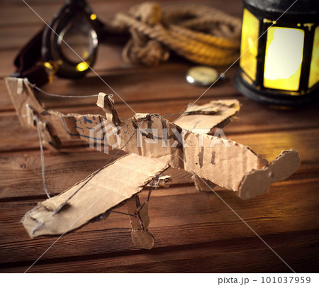 hand made children airplane on wood table 101037959