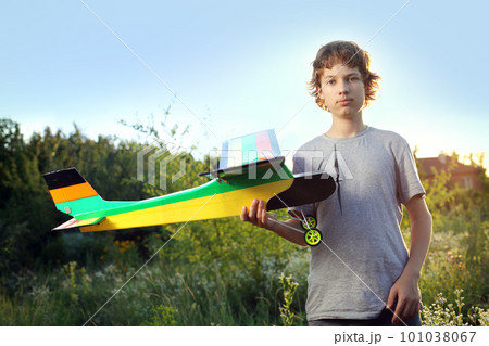 Teen with homemade radio-controlled model aircraft Teen with homemade radio-controlled model aircraft 101038067
