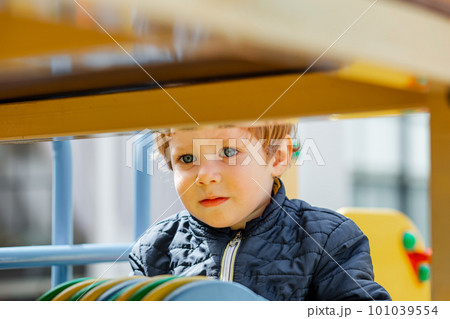 Children are enjoying athletic playground equipment. The kid plays 101039554