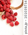 raspberry in a basket on the table 101039734