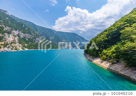 Wide angle view of Piva lake or Pivske Jezero in Montenegro at summer noon 101040210