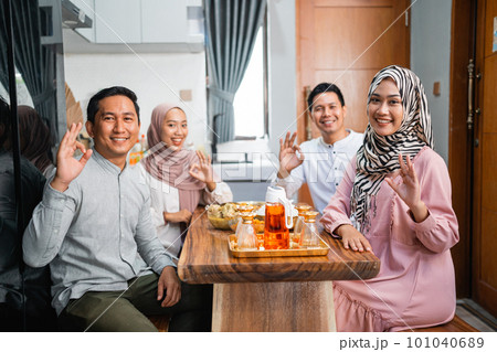people having dinner together and showing thumb up gesture people having dinner together and showing thumb up gesture 101040689