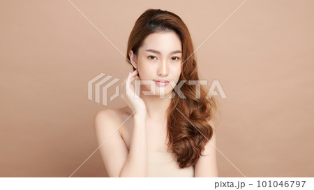 Beautiful young asian woman with clean fresh skin on beige background, Face care, Facial treatment, Cosmetology, beauty and spa, Asian women portrait. 101046797
