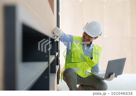 Foreman or Civil engineer working and quality check at construction site. Asian foreman construction standing at construction office Foreman or Civil engineer working and quality check at construction site. Asian foreman construction standing at construction office 101046838