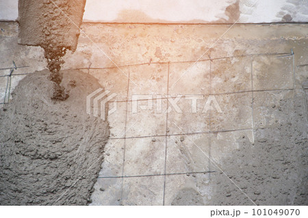 Concrete cement work for floor pouring with wire mesh at the construction agency 101049070