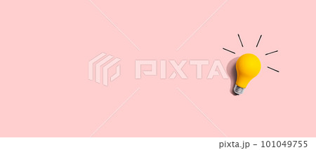 Yellow light bulb - flat lay 101049755