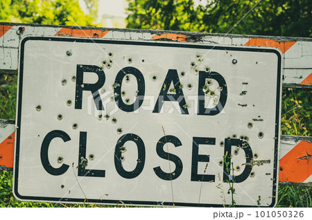 Buckshot road closed sign in front of a washed out bridge 101050326