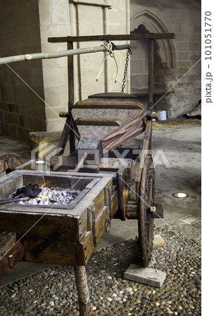 Old wooden chair in a metal basket 101051770
