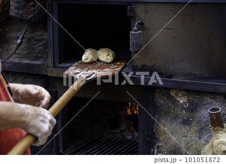 Old man with a metal cutting meat Old man with a metal cutting meat 101051872