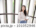 Young pretty woman holding some notebooks 101052946
