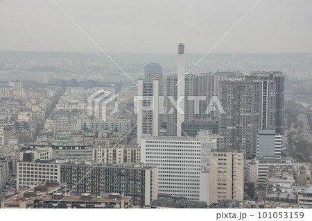 Scenic, aerial view over Paris on a hazy day in Paris, France. Scenic, aerial view over Paris on a hazy day in Paris, France. 101053159