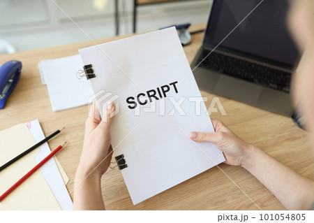 Hands of woman holding script papers for movie in hands 101054805