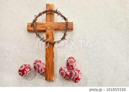 Christian Cross and and Colorful Easter Eggs on vintage background Christian Cross and and Colorful Easter Eggs on vintage background 101055530
