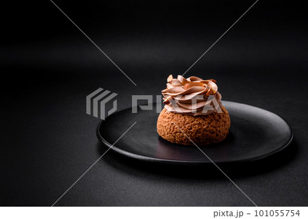 Delicious sweet shu cake with cream and nuts 101055754