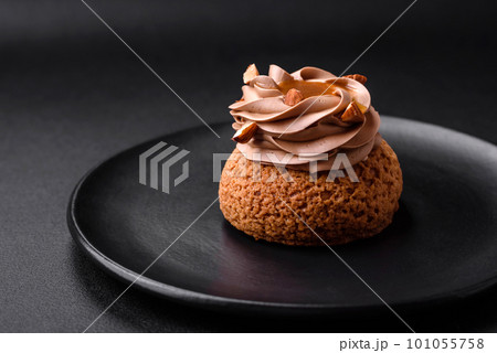 Delicious sweet shu cake with cream and nuts 101055758