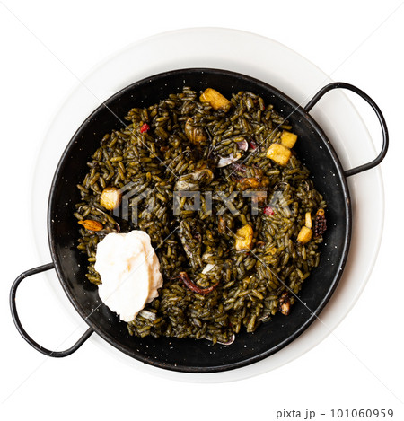 Traditional Catalan black paella with cuttlefish ink served with aioli Traditional Catalan black paella with cuttlefish ink served with aioli 101060959