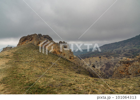 Landscape of Karadag Reserve in spring. View of rocks of ridge Karagach. Crimea 101064313