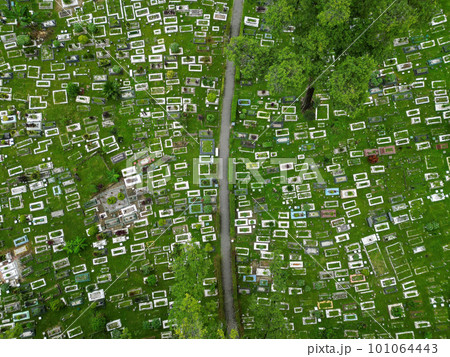 Aerial view of green lush Muslim cemetery 101064443