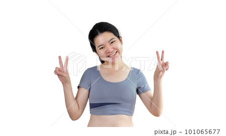 Young Asian woman making two thumbs up gesture showing joy and fun, Symbol of good friendship, Popular photo poses, Make a v-shaped finger, White background. 101065677