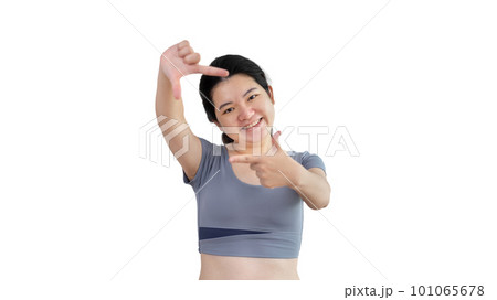 Playful young asian woman in good mood posing for photo or photo frame with fingers on white background,  Use your fingers to act like a photograph, Mark as if taking a photo. 101065678