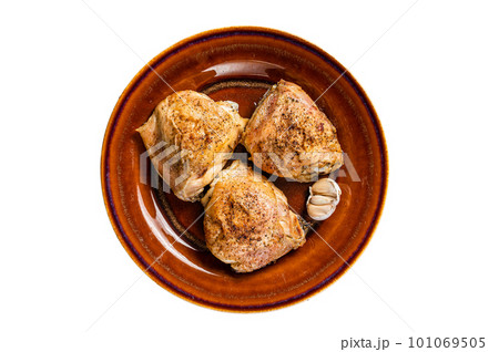 Roasted chicken thighs with spices in a plate. Isolated on white background Roasted chicken thighs with spices in a plate. Isolated on white background 101069505