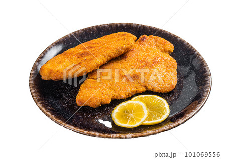 Roasted breaded german weiner schnitzel on a plate. Isolated on white background 101069556