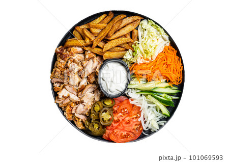 Shawarma Doner kebab on a plate with french fries and salad. Isolated on white background. 101069593