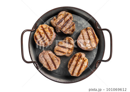 Fried pork medallions steaks from tenderloin meat. Isolated on white background. Fried pork medallions steaks from tenderloin meat. Isolated on white background. 101069612