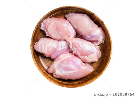 Fresh Chicken thigh meat, Raw Boneless and skinless fillet in a wooden plate. Isolated on white background Fresh Chicken thigh meat, Raw Boneless and skinless fillet in a wooden plate. Isolated on white background 101069764