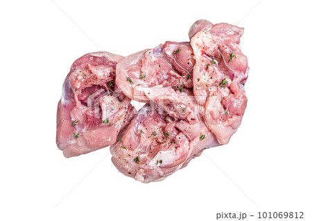 Sliced raw Chicken leg thigh fillet meat ready for cooking with spices. Isolated on white background 101069812
