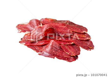 Dried sliced basturma, cured beef meat ready for eat. Isolated on white background. Dried sliced basturma, cured beef meat ready for eat. Isolated on white background. 101070041