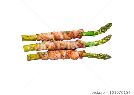Plate with pork bacon wrapped asparagus on grey table. Isolated on white background. 101070154